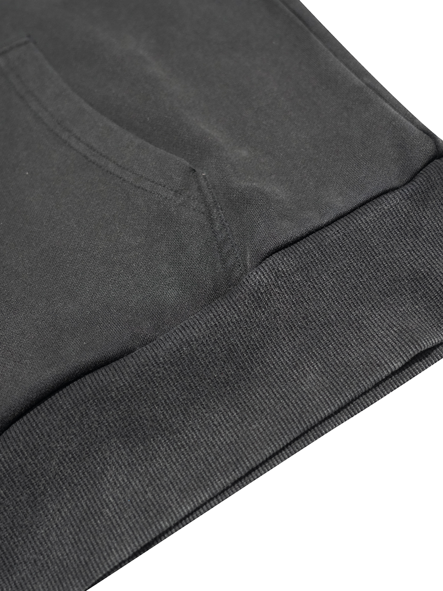 Close-up of a dark gray sweatshirt with ribbed cuffs on a white background