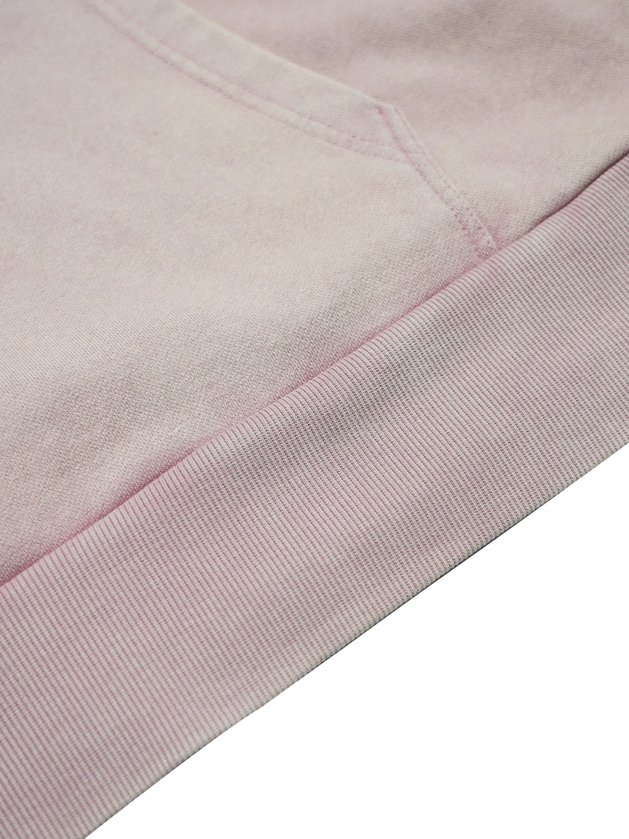 Close-up of a pink fabric with a subtle pattern on a white background