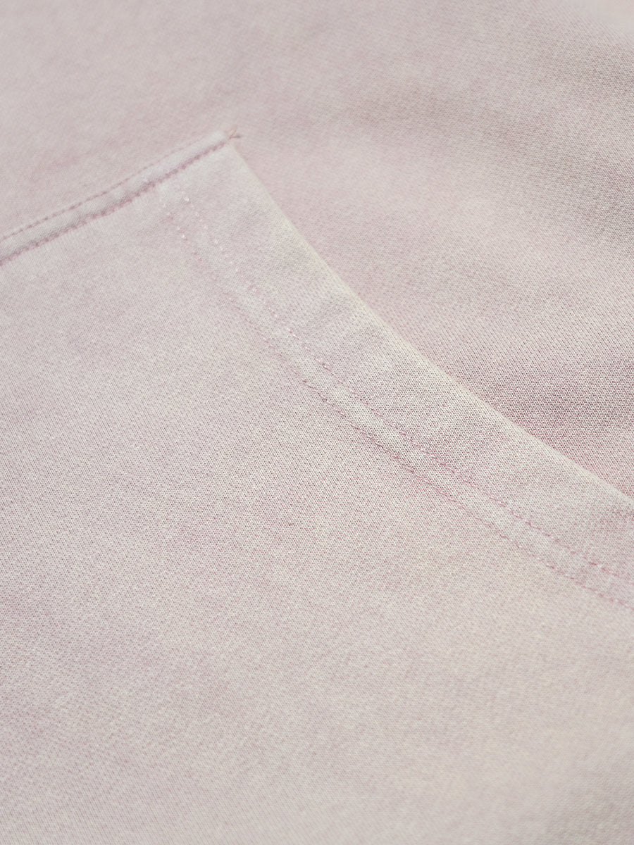 Close-up of a light pink fabric with a subtle texture
