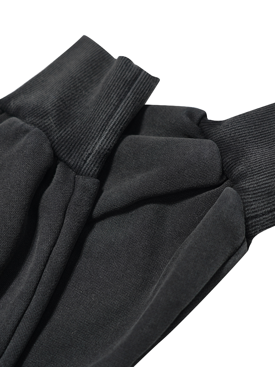 Close-up of black cuffs on a white background