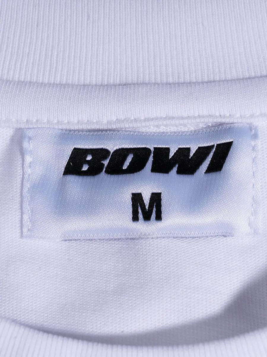 Close-up of a label on a white garment with 'BOWI' and size 'M'.
