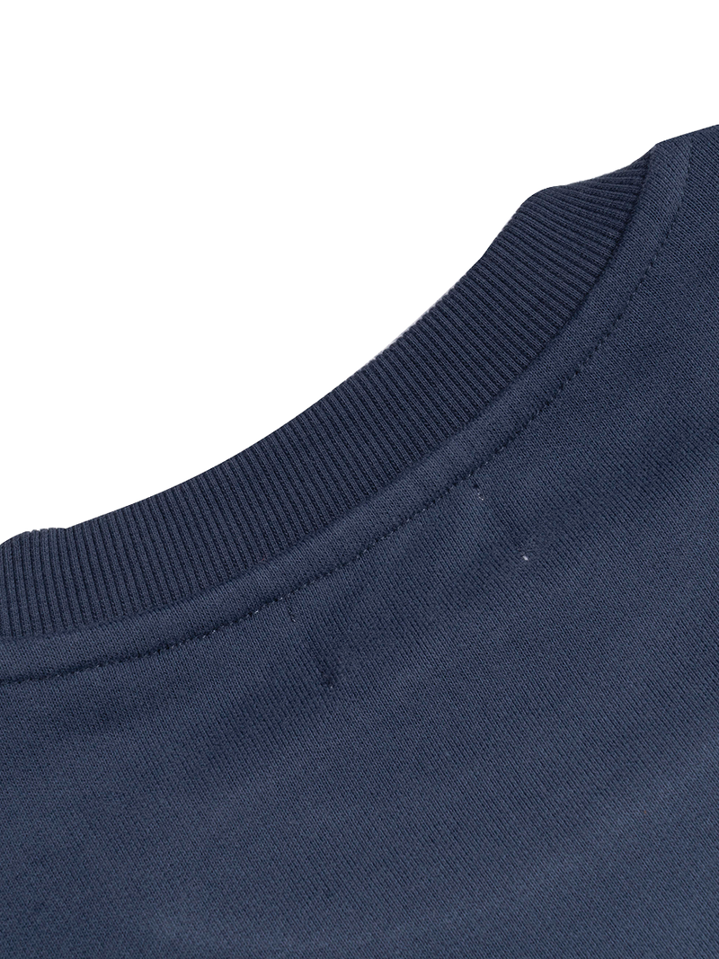Close-up of a navy blue fabric texture on a white background