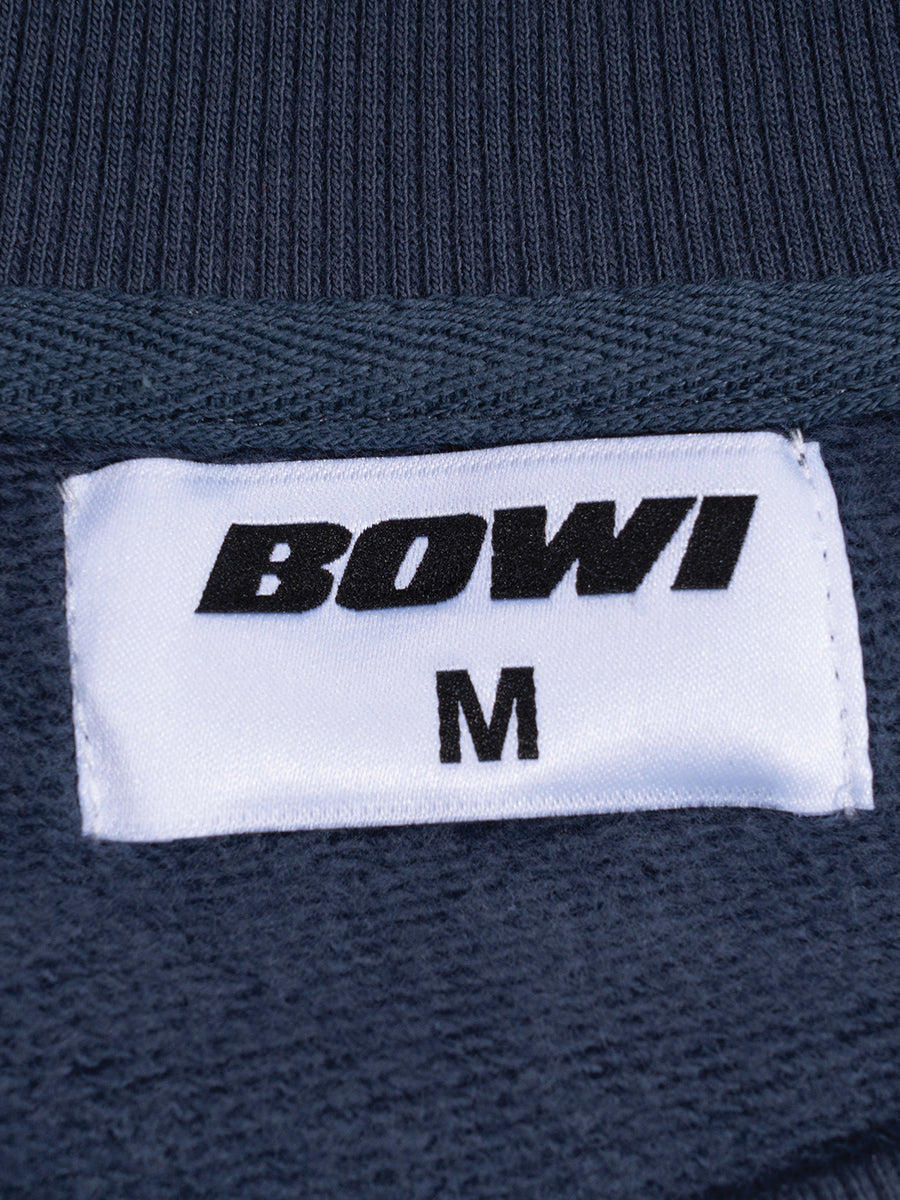 Navy blue fabric with a 'BOWI' label and size 'M'.