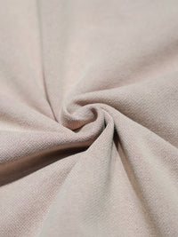 Close-up of pink fabric with a textured surface