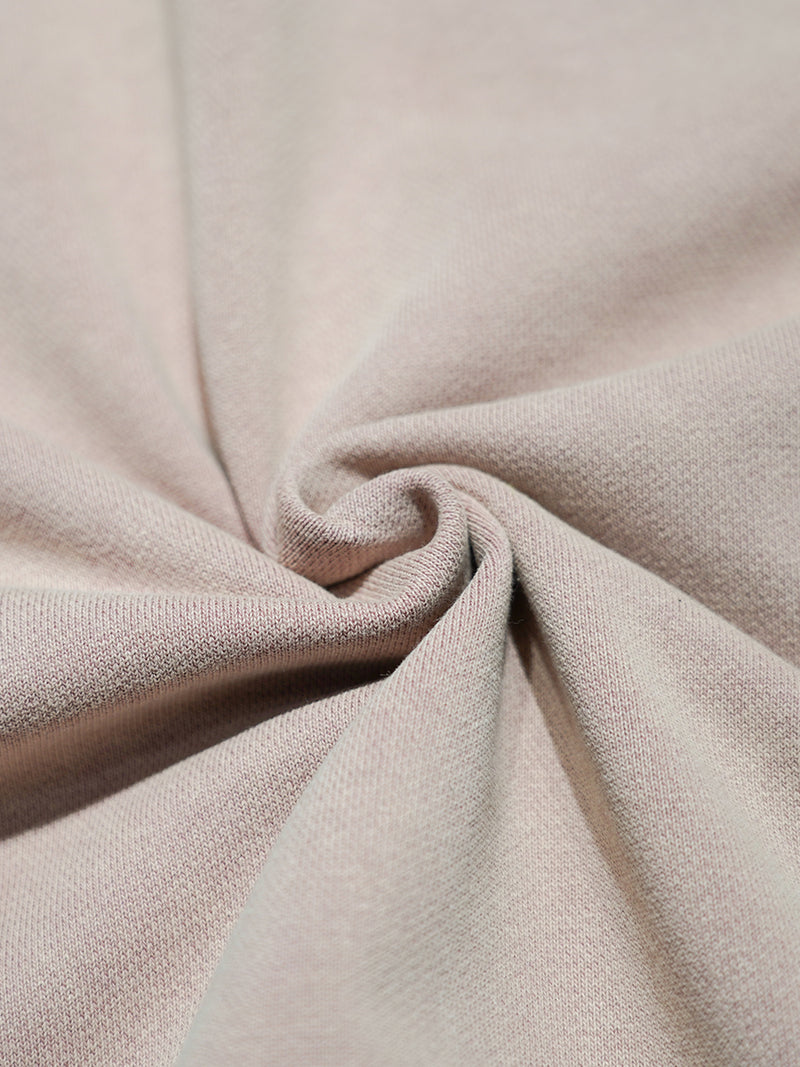 Close-up of pink fabric with a textured surface