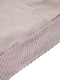 Close-up of a pink fabric with a subtle pattern on a white background