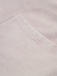 Close-up of a light pink fabric with a subtle texture