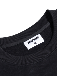 Black sweatshirt collar with 'BOWI' brand label on a white background