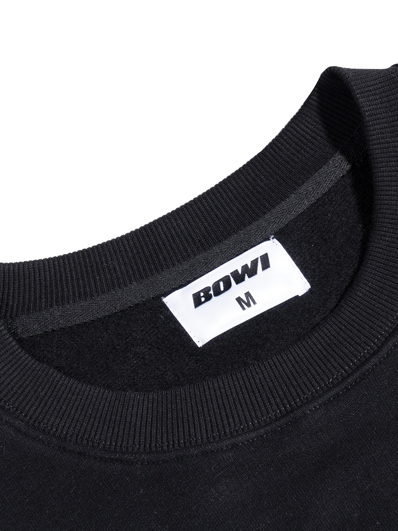 Black sweatshirt collar with 'BOWI' brand label on a white background