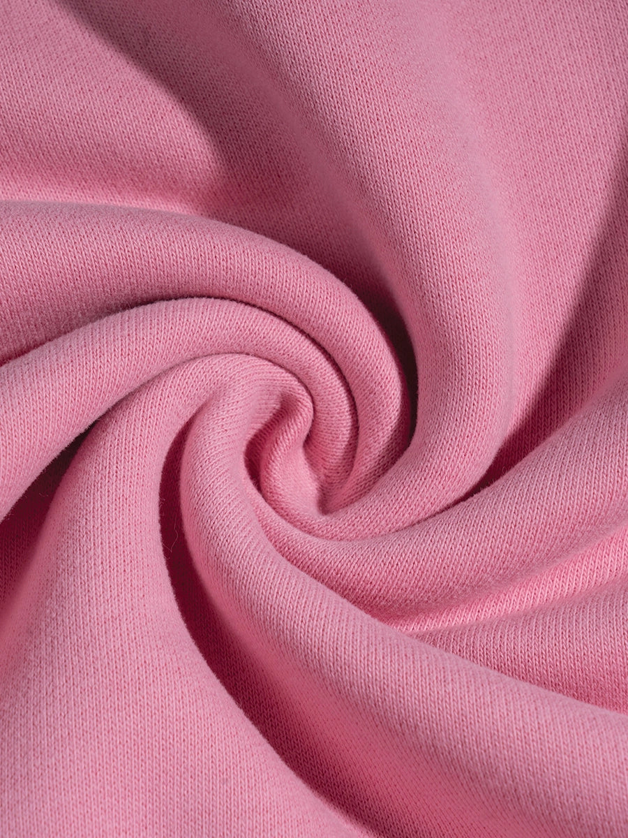 Close-up of pink fabric with a swirl pattern