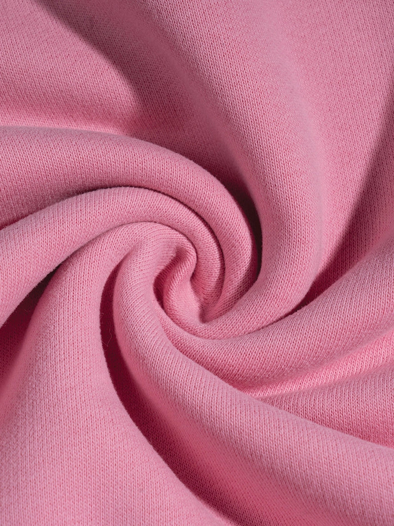 Close-up of pink fabric with a swirl pattern