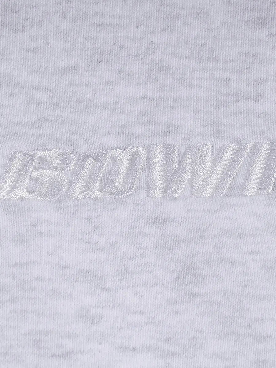 Close-up of a light gray sweatshirt with a brand logo on the chest.