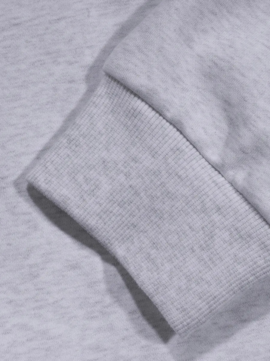 Close-up of a textured gray fabric with a focus on the material and texture.