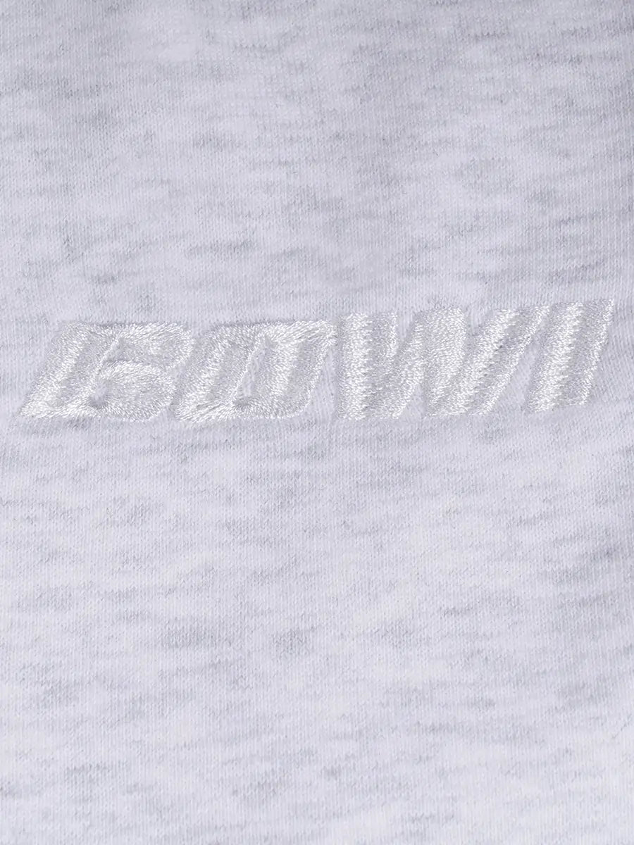 Close-up of a logo on a light gray sweatpant logo