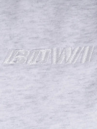 Close-up of a logo on a light gray sweatpant logo